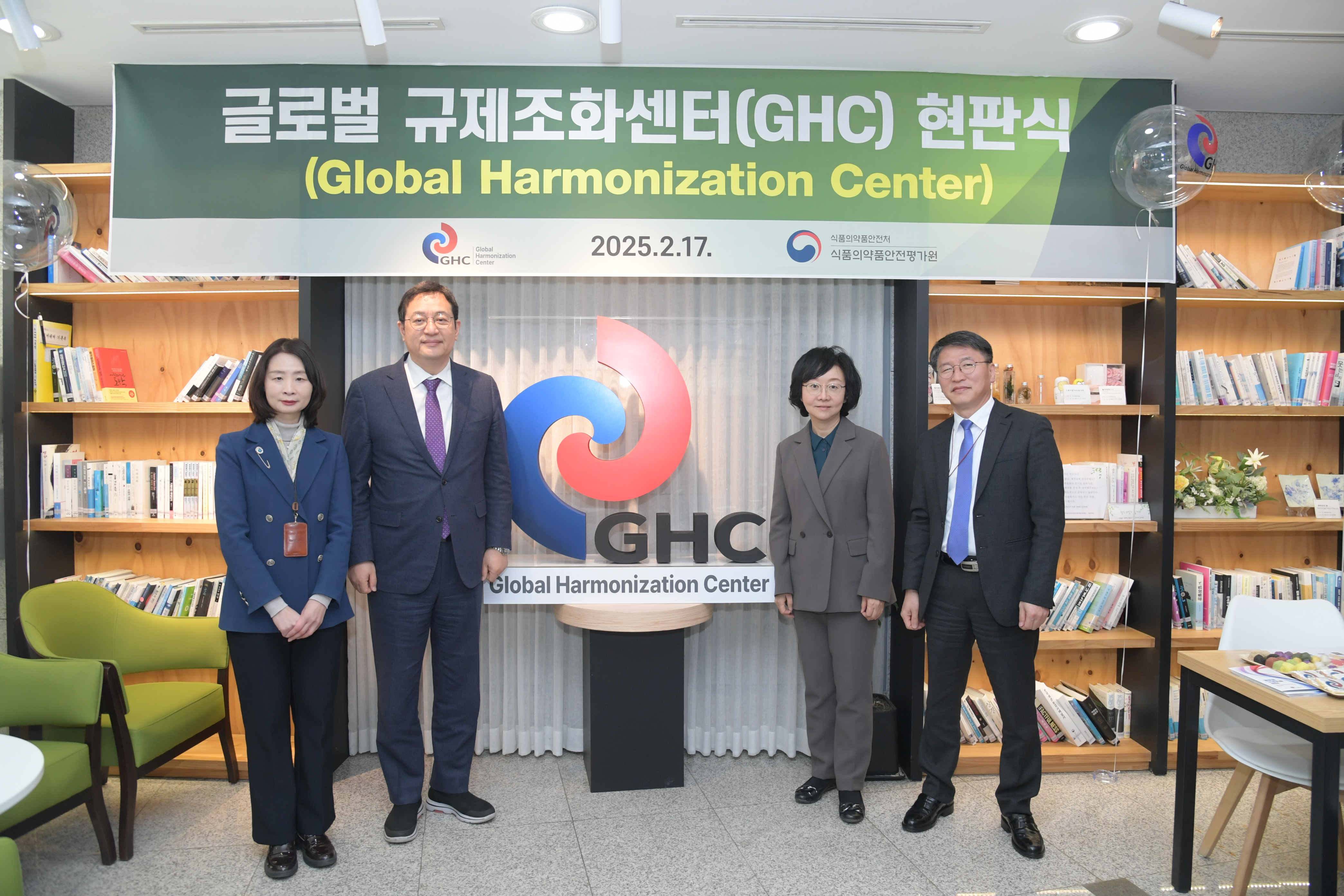 Group photo at banner